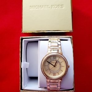 Michael Kors gold watch with diamond accents.